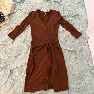 Free people dress in gold brown color. Mid length sleeve